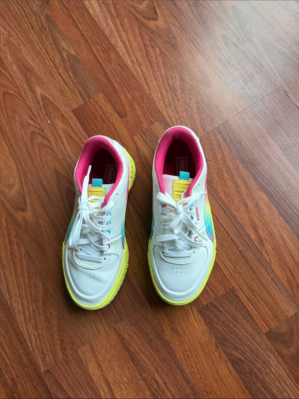 Puma White Sneakers with Neon Yellow Soles and Pink Lining